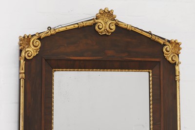 Lot 724 - A neoclassical rosewood and parcel-gilt mirror