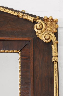 Lot 724 - A neoclassical rosewood and parcel-gilt mirror