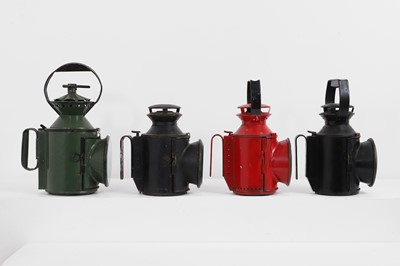 Lot 470 - A set of four painted railway oil lamps
