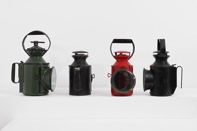 Lot 470 - A set of four painted railway oil lamps