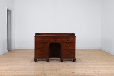 Lot 198 - A mahogany kneehole desk in the manner of Gillows