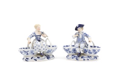 Lot 93 - A pair of Meissen porcelain figural double salts