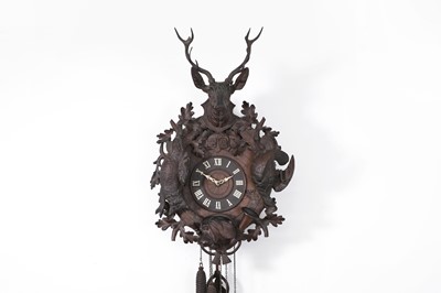 Lot 560 - A Black Forest carved cuckoo clock