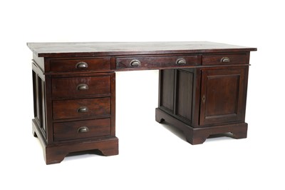 Lot 535 - A teak pedestal desk