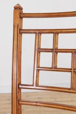 Lot 454 - A set of four Victorian Aesthetic period satinwood side chairs by Howard & Sons
