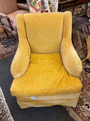 Lot 426 - A pair of upholstered armchairs in the style of Howard & Sons