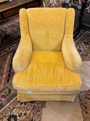 Lot 426 - A pair of upholstered armchairs in the style of Howard & Sons