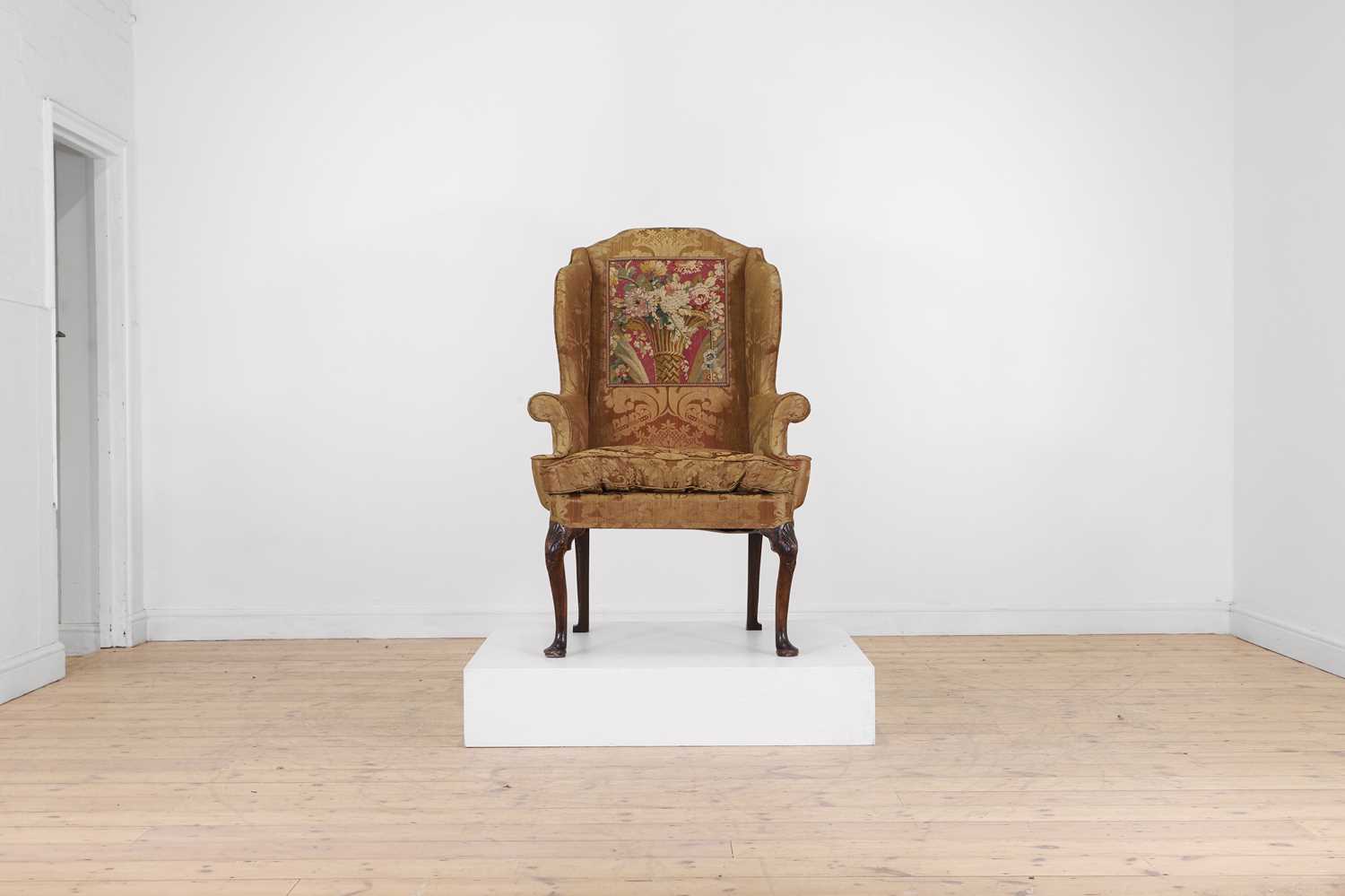 Lot 319 - A George I walnut wingback armchair