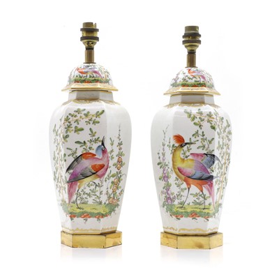 Lot 658 - A pair of French porcelain table lamps