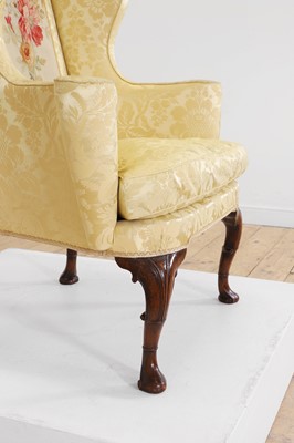 Lot 448 - A George I walnut and beech wing armchair