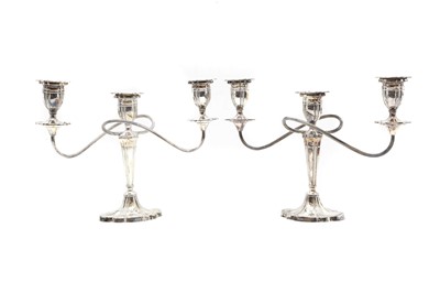 Lot 7 - A pair of silver three-branch candelabra