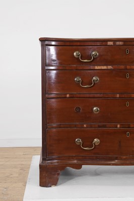 Lot 394 - A George III mahogany serpentine chest