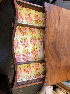 Lot 394 - A George III mahogany serpentine chest