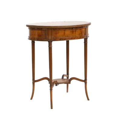 Lot 666 - An Edwardian mahogany work table