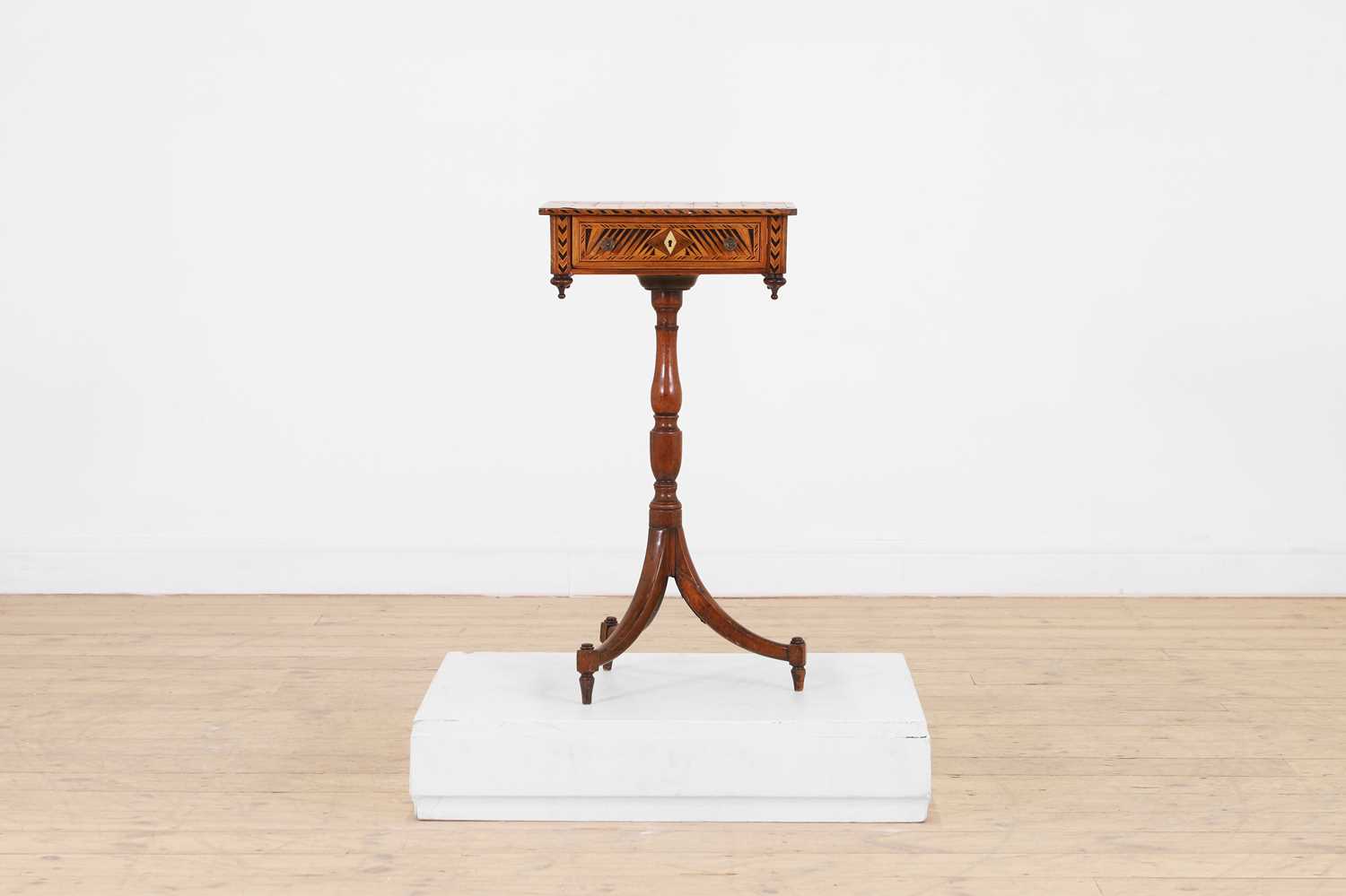 Lot 398 - A Regency rosewood and boxwood games table