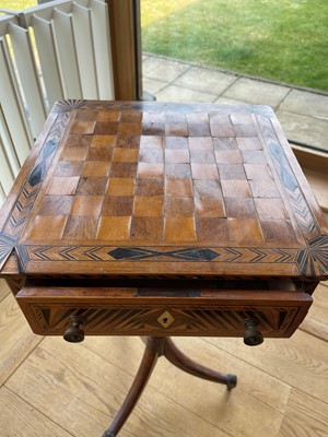 Lot 398 - A Regency rosewood and boxwood games table