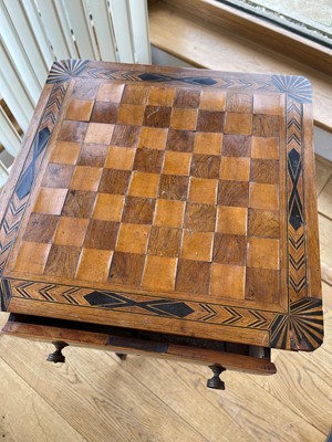 Lot 398 - A Regency rosewood and boxwood games table