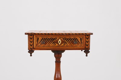 Lot 398 - A Regency rosewood and boxwood games table