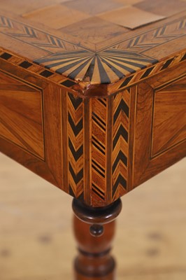Lot 398 - A Regency rosewood and boxwood games table