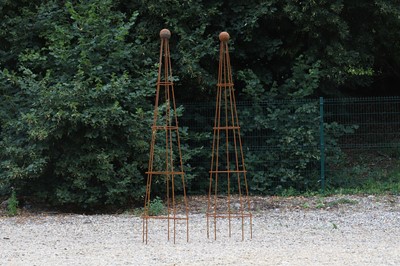 Lot 755 - A pair of conical metal obelisk planters