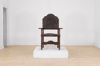 Lot 577 - A Renaissance-style carved walnut throne chair