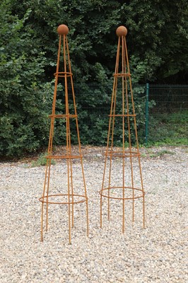 Lot 758 - A pair of metal obelisk planters
