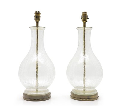 Lot 568 - A pair of glass vase form table lamps