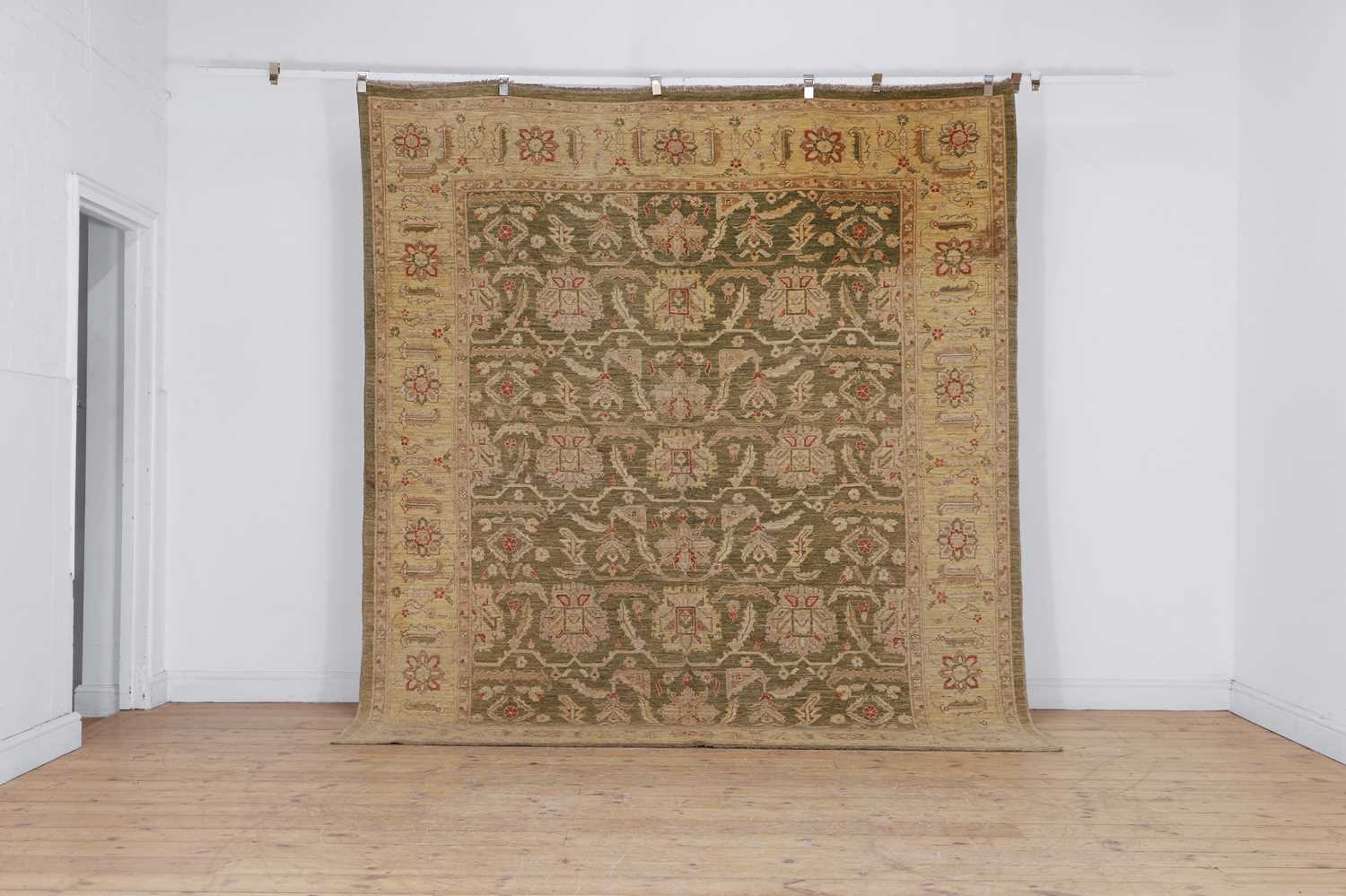 Lot 453 - An Agra design wool rug
