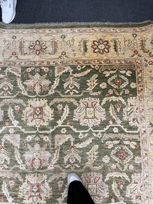 Lot 453 - An Agra design wool rug