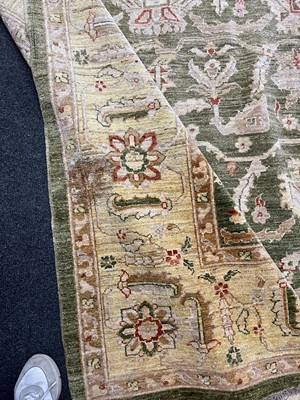Lot 453 - An Agra design wool rug