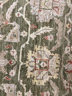 Lot 453 - An Agra design wool rug