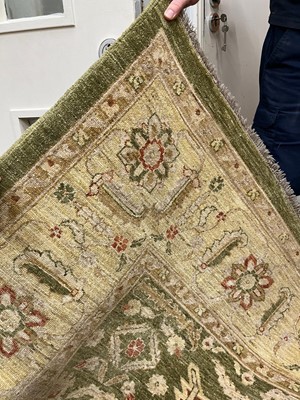 Lot 453 - An Agra design wool rug