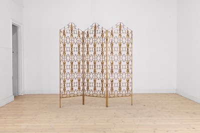 Lot 726 - A pierced gilt-metal folding screen