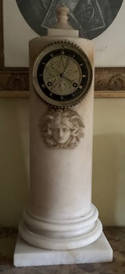 Lot 127 - An Empire alabaster mantel clock