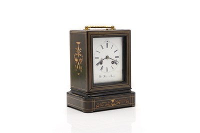 Lot 294 - An ebonised marquetry mantel clock