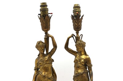 Lot 355 - A pair of French glit metal table lamps