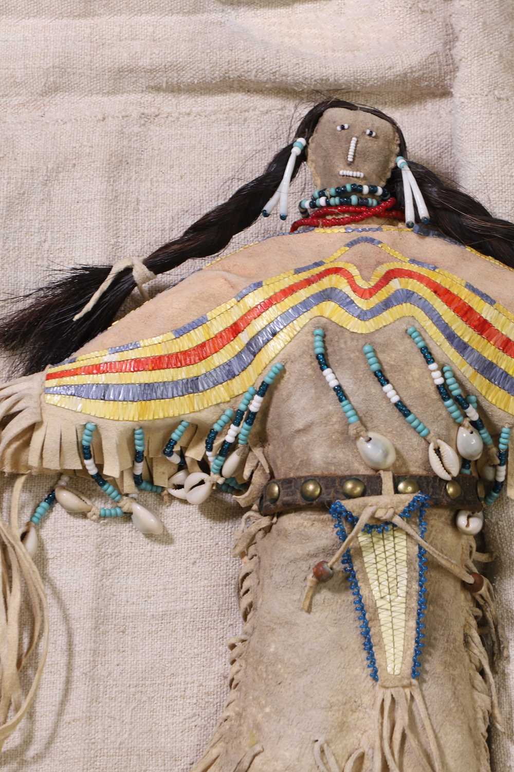 Lot 299 - A Native American beaded and quilled hide doll