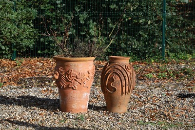 Lot 691 - A terracotta bulbous form olive jar