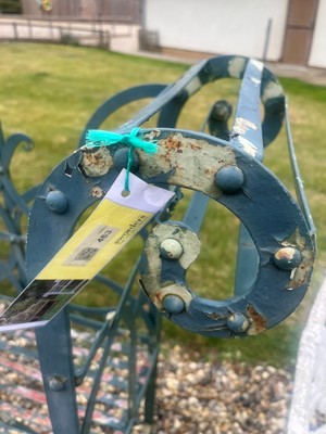 Lot 463 - A painted metal garden bench