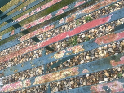 Lot 463 - A painted metal garden bench