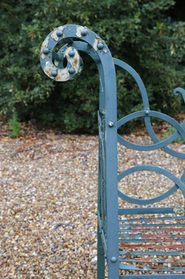 Lot 463 - A painted metal garden bench