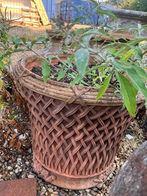 Lot 712 - A pair of terracotta garden planters