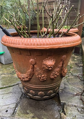 Lot 708 - A set of three terracotta garden jardinieres