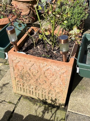 Lot 694 - A set of four terracotta garden jardinieres