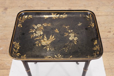 Lot 409 - A papier mâché japanned tray top table