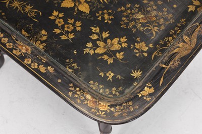 Lot 409 - A papier mâché japanned tray top table