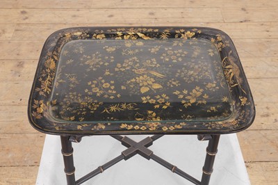 Lot 409 - A papier mâché japanned tray top table