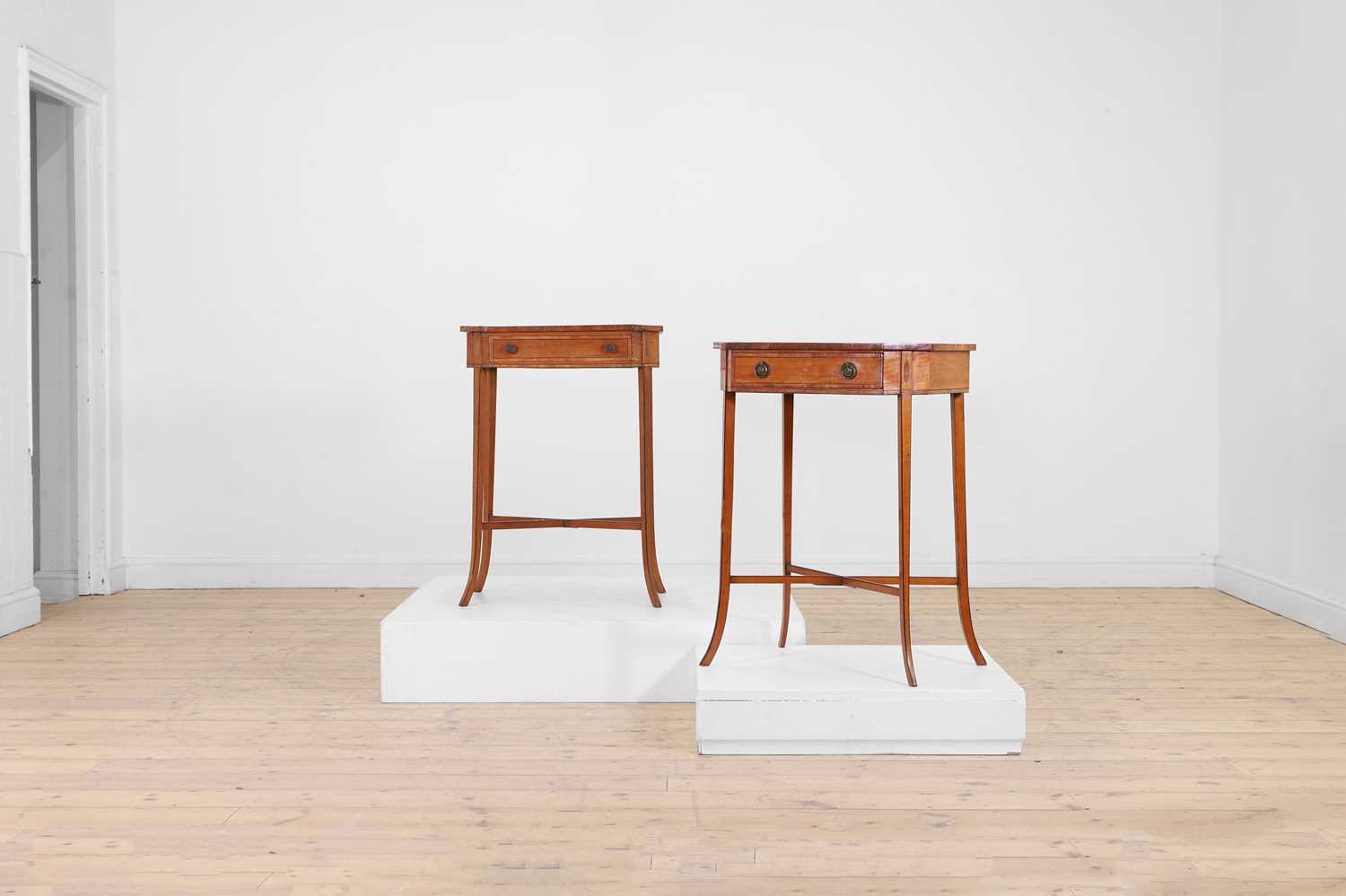 Lot 425 - A near pair of George III satinwood occasional tables