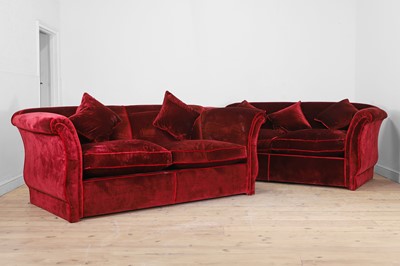 Lot 705 - A pair of red velvet two-seater sofas