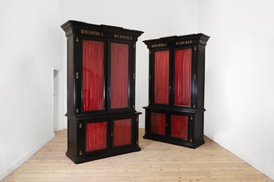 Lot 202 - A pair of ebonised wooden library bookcases